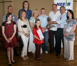 Representatives of youth groups at Holy Trinity Woodburn receive the Danny Nolan Memorial Trophy from the NEELB.